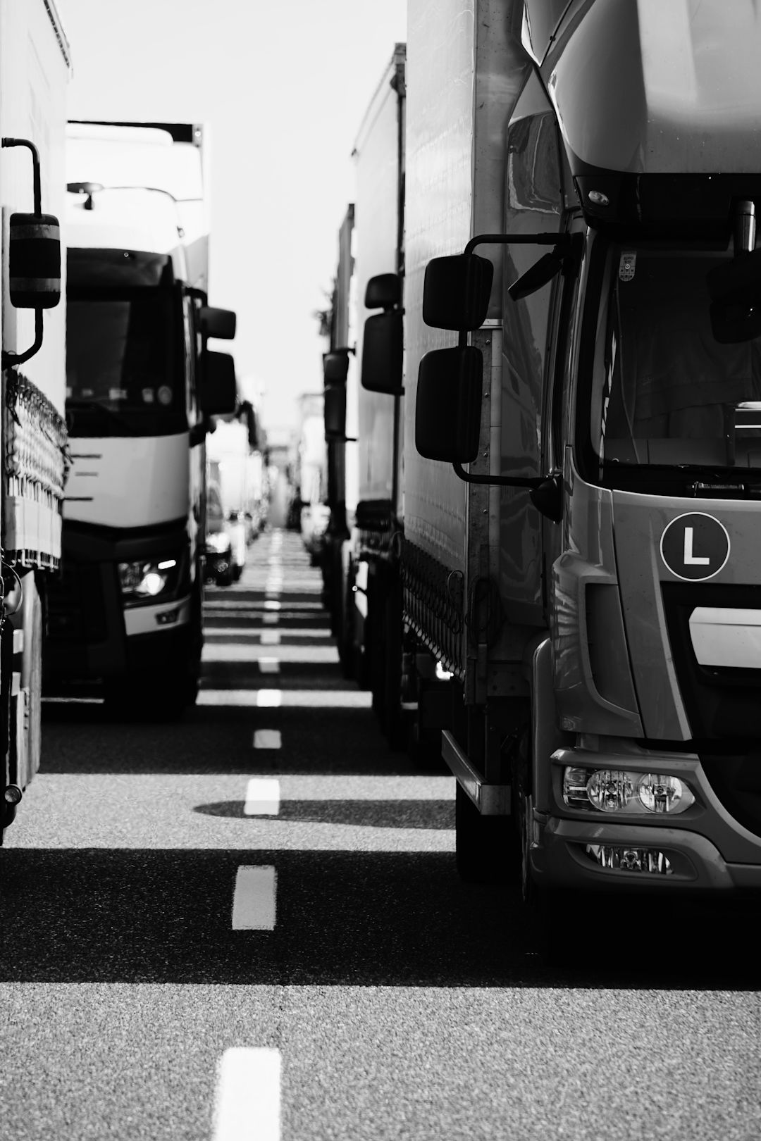 grayscale-photo-of-cars-on-road.jpg grayscale photo of cars on road